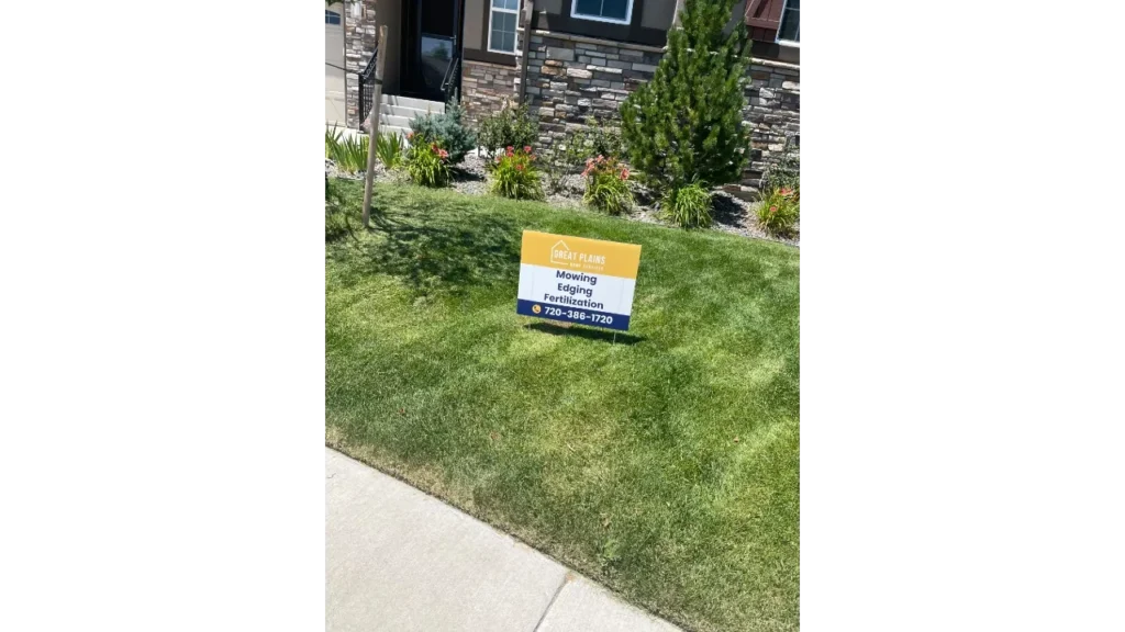 Professional sidewalk edging and clean concrete lines on a green lawn in Windsor, CO.