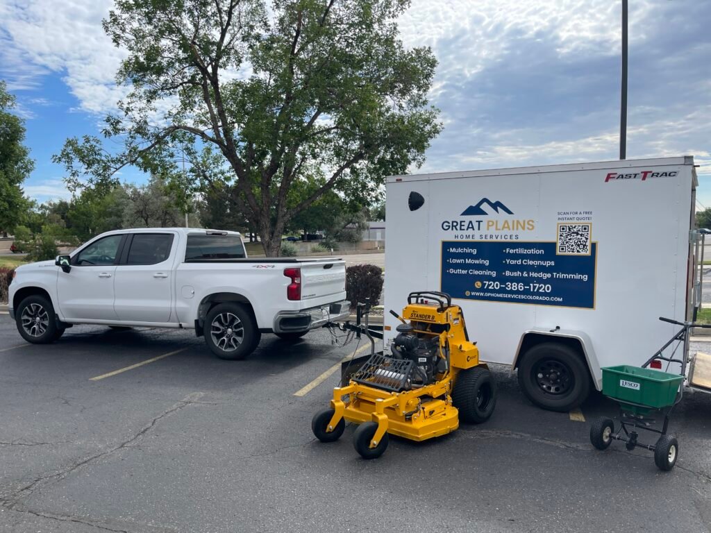 Great Plains Home Services truck, branded trailer, and commercial mower setup for commercial lawn maintenance in Northern Colorado.